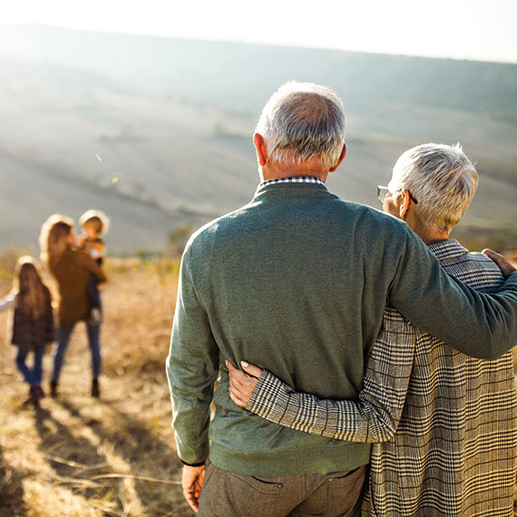 A couple watching their family. Links to Gifts That Pay You Income income.jpg